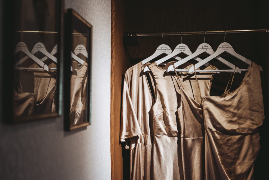 Elegant bridesmaid dress hanging on personalised hanger.