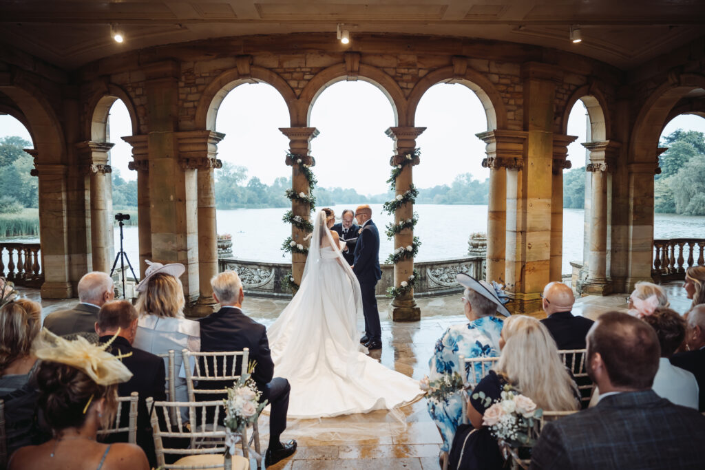 Wedding ceremony inside the loggia at Hever Castle, captured by Luxury Wedding Photographer in Kent, Teri V Photography.