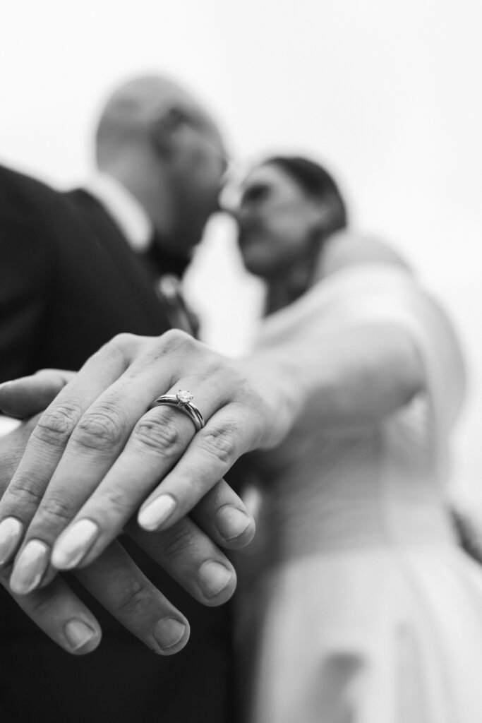 Close-up of wedding rings on bride and groom's hands, captured by Luxury Wedding Photographer in Kent, Teri V Photography.