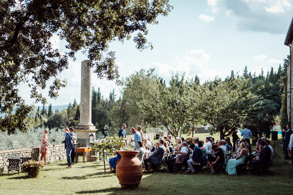 Side view of guests seated and waiting during the ceremony