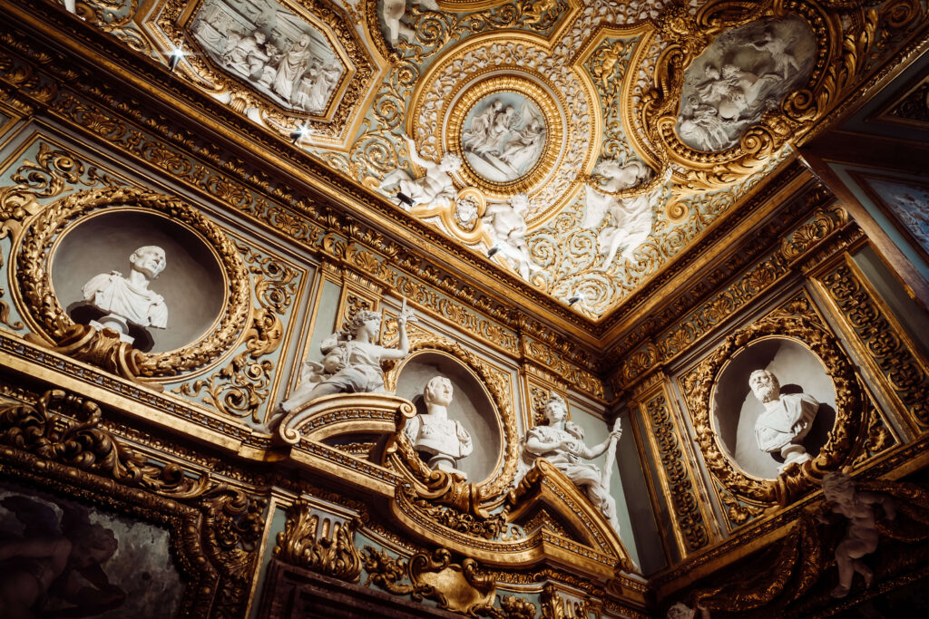 Shot of a beautiful architecture wall and ceiling. It has a gold and white theme